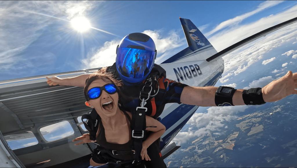 woman smiling after jumping from a plane with Cadence Skydiving sports