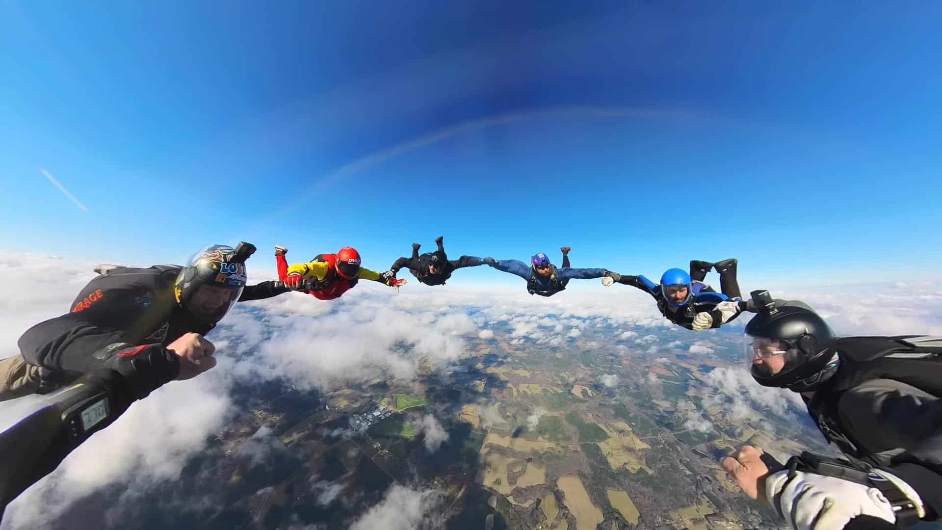 experienced skydivers in a round formation in freefall