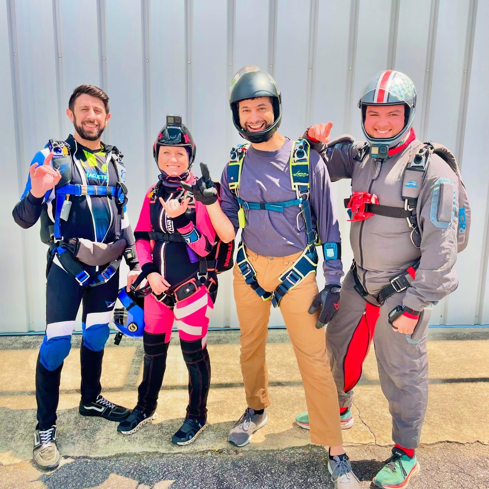 Skydivers in skydiving jumpsuits preparing to board aircraft at Skydive Raleigh